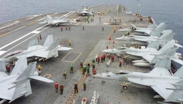 U.S fighter jets on the upper deck of the USS George Washington aircraft carrier in the South China Sea.