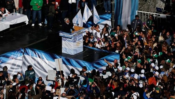 A union leader speaks to workers during a demonstration against Argentine President Mauricio Macri's policies in Buenos Aires, April 29, 2016. 