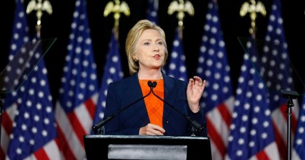 Clinton wears orange for gun violence awareness but holds a violent record on U.S. foreign policy.