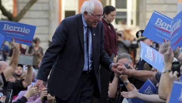  Senator Bernie Sanders greets supporters at a campaign rally outside the New Hampshire State House on Nov. 5, 2015.