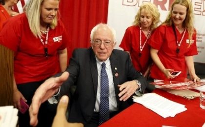 Vermont Senator Bernie Sanders shakes hands with a supporter during a 'Brunch With Bernie' rally at National Nurses United in Oakland, California August 10, 2015.