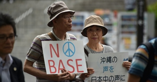 A couple protest against U.S. military intervention in downtown Tokyo