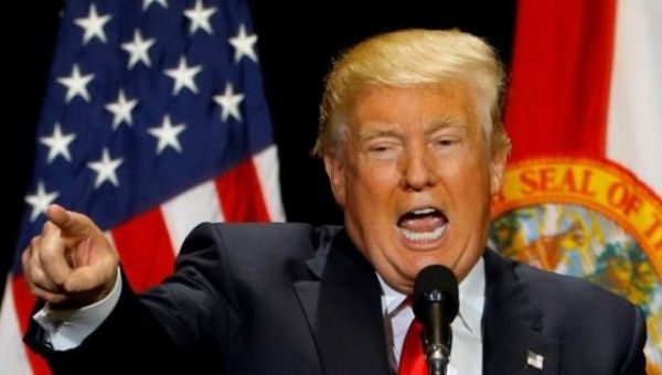 Republican U.S. presidential candidate Donald Trump gestures during a campaign rally in Tampa, Florida, U.S. June 11, 2016.