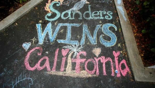 Chalk writing remains on the pavement at the front door of a Bernie Sanders campaign office in El Cajon, California, June 10, 2016.