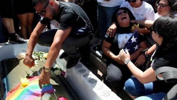 Lucyvette Padro attends the funeral of her son Angel Candelario, a victim of the Orlando shooting, at his hometown of Guanica, Puerto Rico, June 18, 2016.