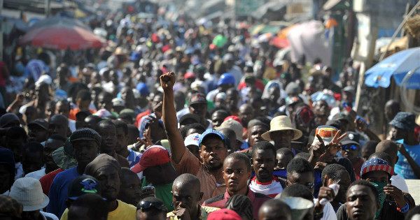 Demonstrators march during a protest in Port-au-Prince, January 2016.