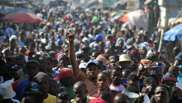 Demonstrators march during a protest in Port-au-Prince, January 2016.