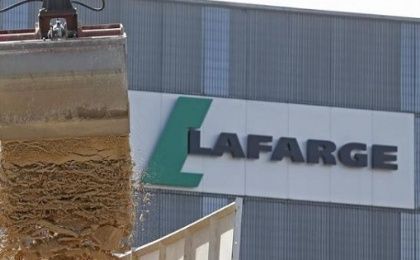 Cement is unloaded from a barge at a Lafarge concrete production plant in Pantin, outside Paris.