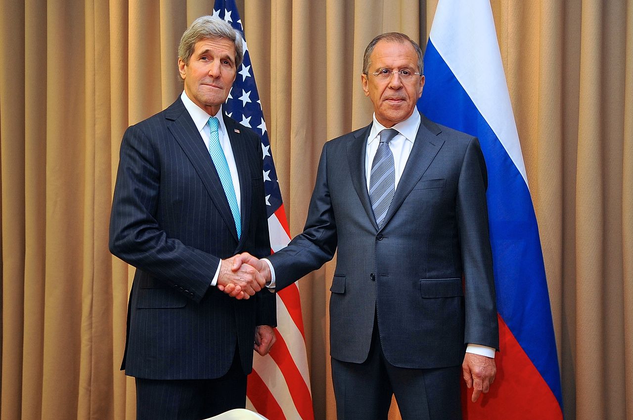 Secretary of State John Kerry and Russian Foreign Minister Sergey Lavrov share a warm embrace.