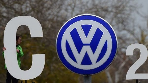 A Greenpeace activist with a CO2 sign at Volkswagen's headquarters in Wolfsburg, Germany, Nov. 9, 2015.