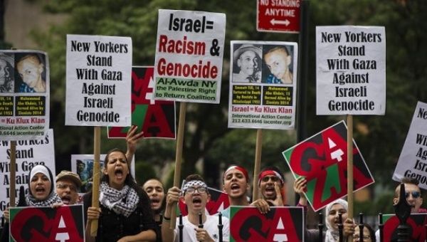 Pro-Palestinian demonstrators display signs outside of New York's City Hall. 