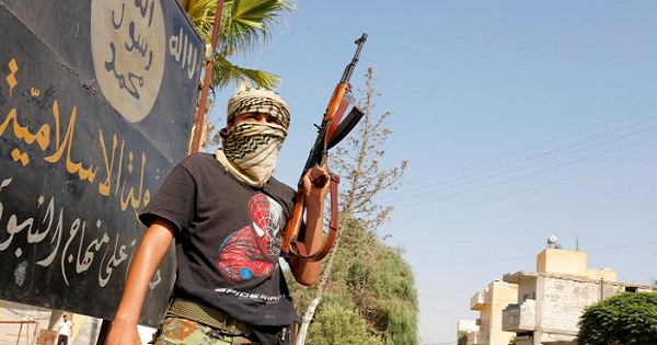 A member of the Turkish-backed Free Syrian Army (FSA) patrols in the border town of Jarablus, Syria, August 31, 2016.