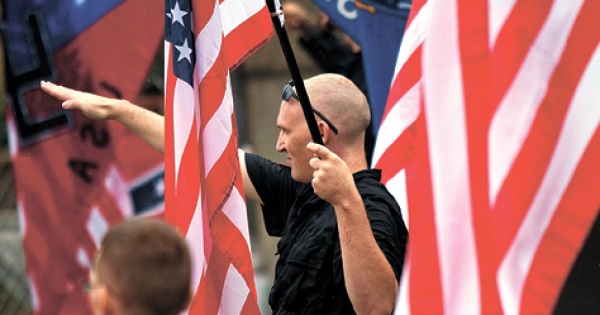 An American neo-Nazi giving the Fascist salute during a rally in Wisconsin in 2011.