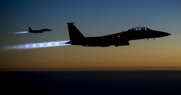 A pair of U.S. Air Force F-15E Strike Eagles fly over northern Iraq after conducting airstrikes in Syria.