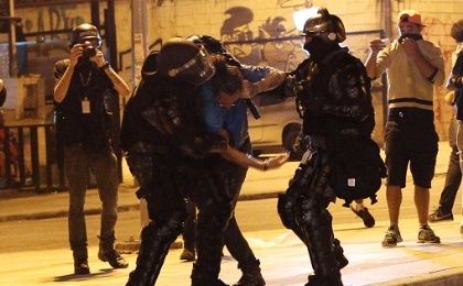 A man is detained by riot police during a protest against Brazil's President Michel Temer in Sao Paulo, Brazil, September 4, 2016.