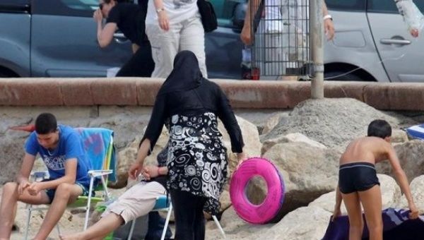 French towns ban Muslim women's beach 'burkini