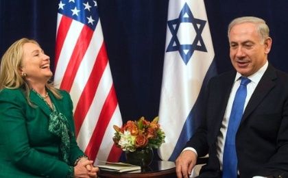 Then U.S. Secretary of State Hillary Clinton laughs during a meeting with Israeli Prime Minister Benjamin Netanyahu, September 27, 2012.