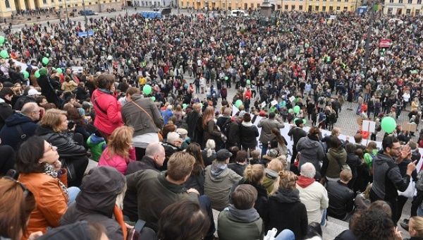 People gather in Senate Square during a protest against racism and fascism in Helsinki, Finland, Sept. 24, 2016.