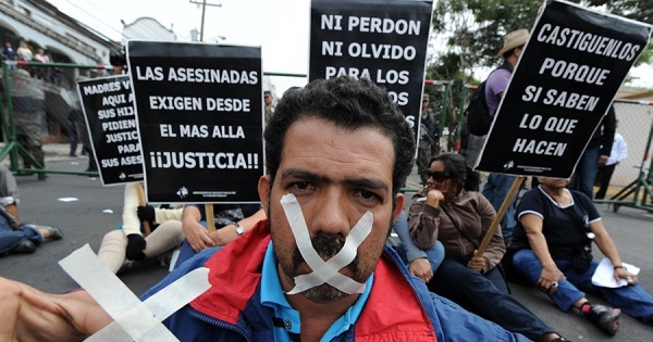 Protestors against the School of Americas' delegation in Tegucigualpa in 2012.