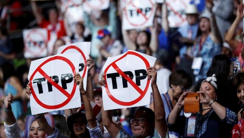 Protesters at the Democratic National Convention express their opposition to the Democratic Party's backing of the Trans-Pacific Partnership, or TPP.