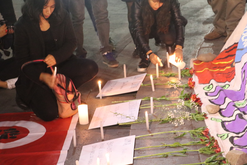 Women placed candles in tribute to the victims of femicide, committed primarily by their spouses and partners. 