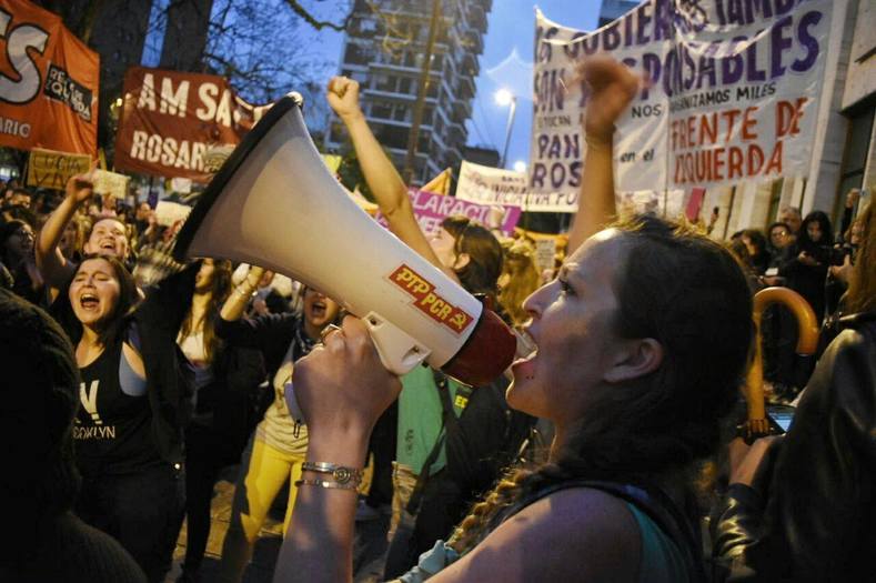 Women in Rosario, Argentina yell 