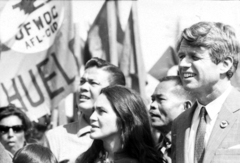 Right to left: U.S. Senator Robert Kennedy, Larry Itliong, Dolores Huerta, and Andy Imutan.