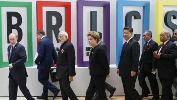  Russian President Vladimir Putin (L), Indian Prime Minister Narendra Modi (3rd L), Brazil's President Dilma Rousseff (C), Chinese President Xi Jinping (4th R) and South African President Jacob Zuma (2nd R) walk after the welcoming ceremony during the BRICS Summit in Ufa, Russia, July 9, 2015.