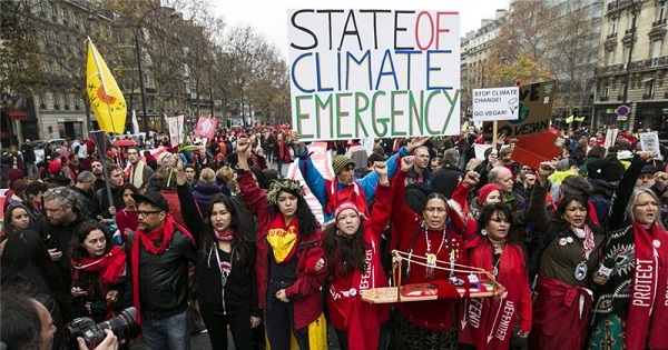 Climate activists march in the streets.