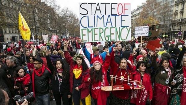 Climate activists march in the streets.