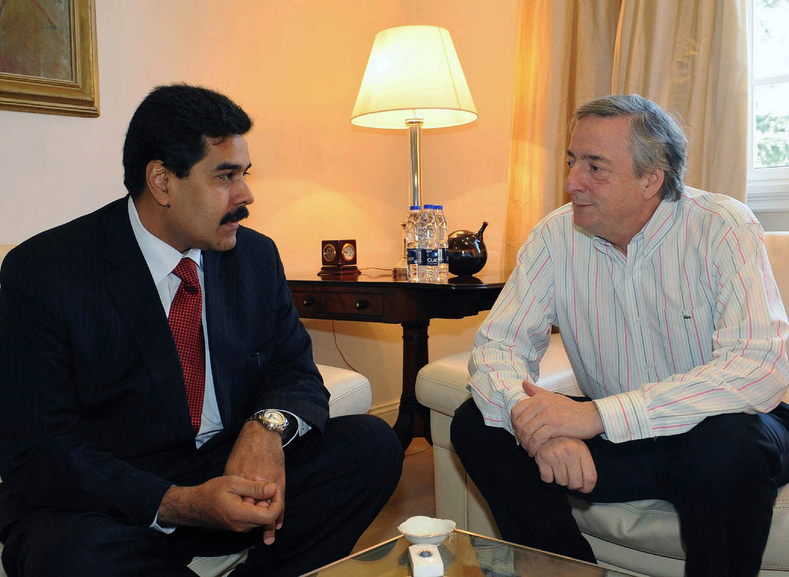 Nicolas Maduro, then Minister for Foreign Relations, speaks with the late Argentine president, in 2010.