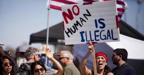 Demonstrators picket before the possible arrival of undocumented migrants who may be processed at the Murrieta Border Patrol Station in Murrieta, California July 4, 2014.