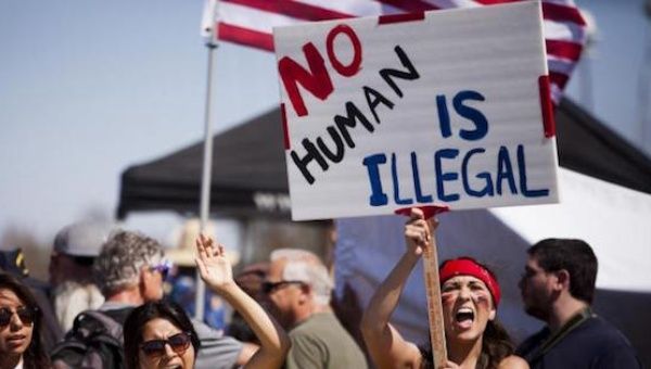 Demonstrators picket before the possible arrival of undocumented migrants who may be processed at the Murrieta Border Patrol Station in Murrieta, California July 4, 2014.