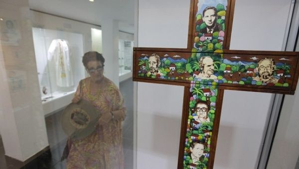 A cross bears the photos of the six Jesuit priests who were murdered by the U.S.-trained Salvadorean army in 1989 during the brutal civil war.