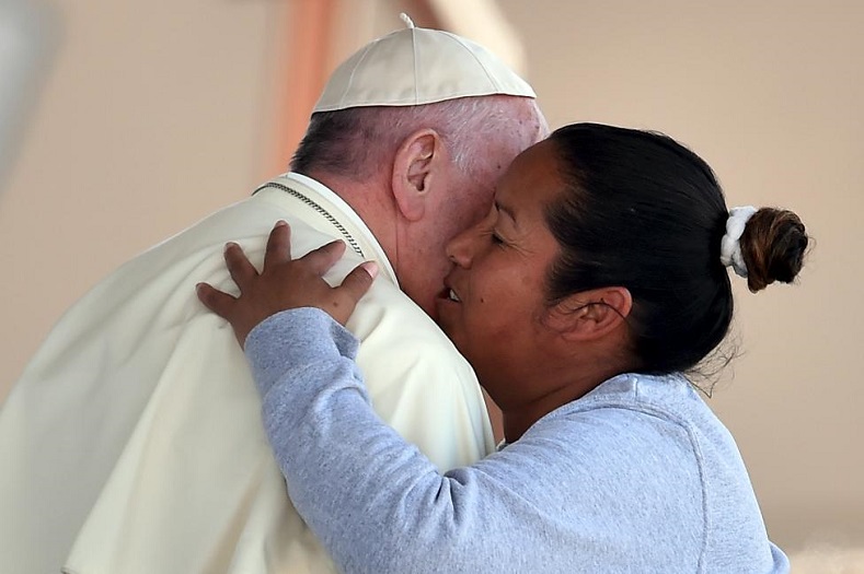 Pope Francis is greeted by a female inmate during his visit to the CeReSo No. 3 penitentiary in Ciudad Juarez, Feb. 17, 2016.