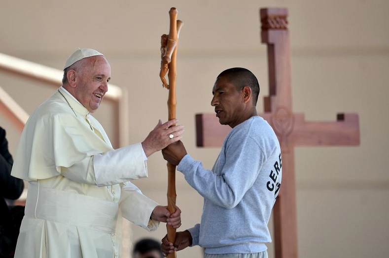 Pope Francis receives a cross made by an inmate during his visit to the CeReSo No. 3 penitentiary in Ciudad Juarez.