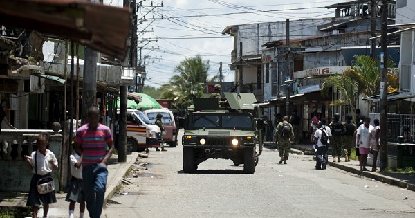 Police patrol the streets of Buenaventura, Colombia. The region has seen rising threats against activists and community leaders.