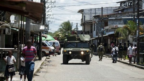 Police patrol the streets of Buenaventura, Colombia. The region has seen rising threats against activists and community leaders. 