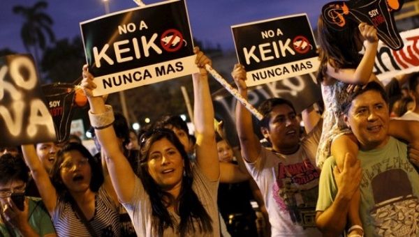 People protest against presidential front runner, and daughter of former dictator, Keiko Fujimori in downtown Lima, Peru March 11, 2016. 