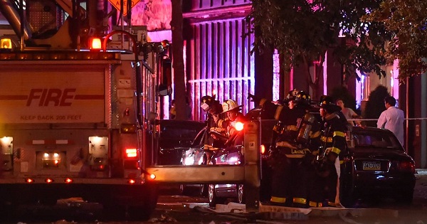 New York City firefighters investigated the site of an explosion in the Chelsea neighborhood of New York on Saturday night.