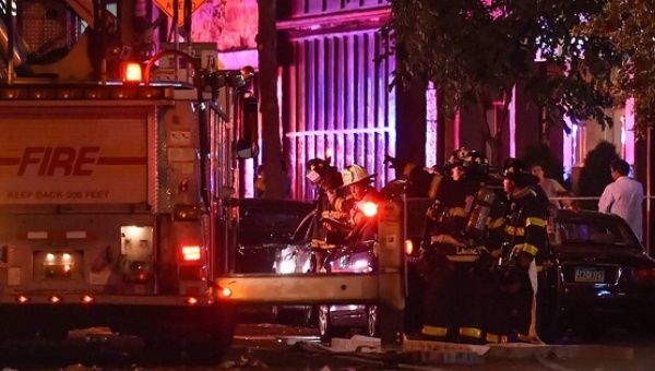 New York City firefighters investigated the site of an explosion in the Chelsea neighborhood of New York on Saturday night.