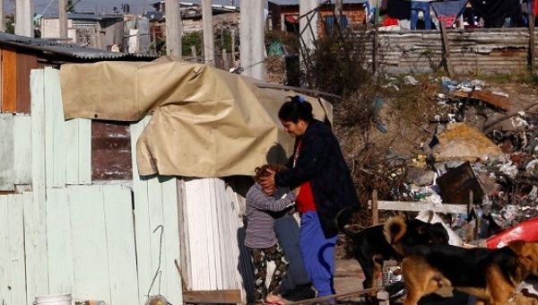  A woman and her daughter stand outside their shack in a slum of Villa Fiorito, on the outskirts of Buenos Aires, Argentina, June 15, 2016