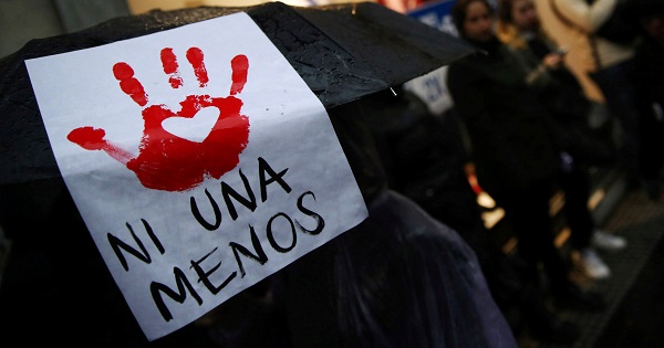 A woman carries a sign during a demonstration to demand policies to prevent gender violence in Buenos Aires, Argentina, Oct. 19, 2016.