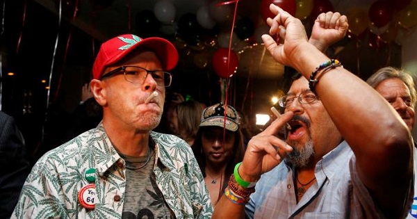 William Britt (L) and Al Moreno (R) celebrate after Californians voted to pass Prop 64, legalizing recreational use of marijuana in the state, in Los Angeles, California, U.S. Nov. 8, 2016.