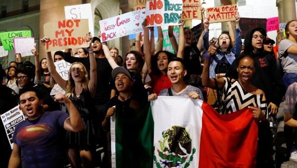 Demonstrators protest outside of City Hall following the election of Republican Donald Trump as president of the United States in downtown Los Angeles, California.