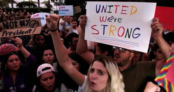 People protest against U.S. President-elect Donald Trump in Miami, Florida.