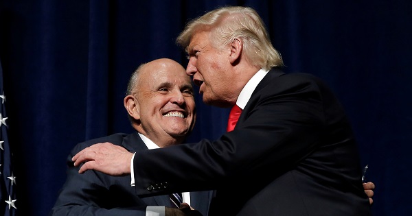 Rudy Giuliani, Republican former mayor of New York City, shakes hands with Donald Trump.