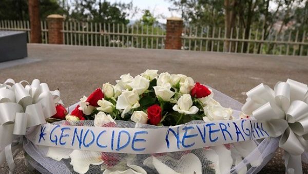 A bouquet of flowers tied with a ribbon showing the message 