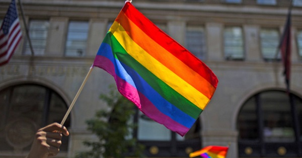 The Pride flag held at a Pride rally in NYC.