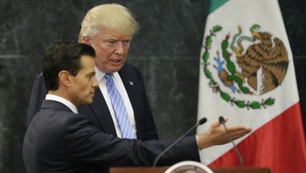 U.S. President-elect Donald Trump and Mexico's President Enrique Pena Nieto arrive for a press conference in Mexico City, Mexico, August 31, 2016. 